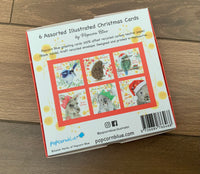 6 Assorted Illustrated Christmas Cards in Red Box by Popcorn Blue. back of box