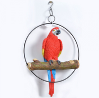 Bright red parrot perched on a branch in a black ring. Ring is 24.5cm great addition to any garden area