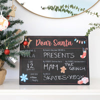 Dear Santa Chalkboard. Fill out in chalk the persons Name Age Wishlist, their favourite - thing about christmas, food and Movie. Last of all have they been naughty or nice. Lifestyle shot