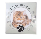 Silver photo frame with a round photo insert, with I love my Cat above and a paw print in black beneath. Embossed around the outer of the photo insert are more paw prints.