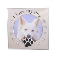 Silver photo frame with a round photo insert, with I love my Dog above and a paw print in black beneath. Embossed around the outer of the photo insert are more paw prints.