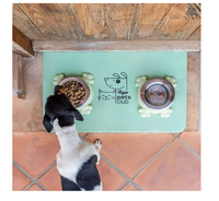 Pet Club feeding mat - lifestyle shot with dog eating from bowl