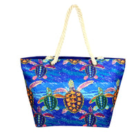 Beach Bag with Multilple turtle and blue ocean design with blue backing and zip. Made from polyester - rope handles