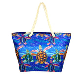 Beach Bag with Multilple turtle and blue ocean design with blue backing and zip. Made from polyester - rope handles