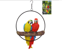 Beautiful and bright twin parrot birds in a ring, 40cm in length ring 37cm. Fantastic for any bird lover or just to brighten your day!