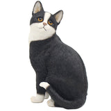Black and White Cat Figurine Sitting by Leonardo Design