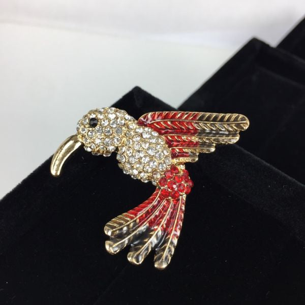 Beautiful crystal body bird brooch with red wings and tail
