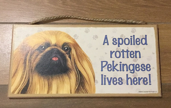 Sign and image - A spoiled rotten Pekingese lives here! 