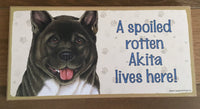 Sign and Image - A spoiled rotten Akita lives here!