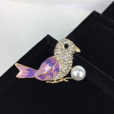 Beautiful crystal headed bird with mauve wings and tail.