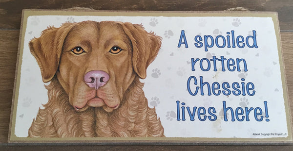 Sign with an image: A spoiled rotten Chessie lives here!