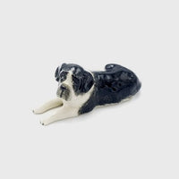 Black - Laying Down - This ceramic collectable figurine measures approx 8.5cm x 5cm x 3.5cm high.