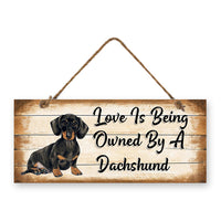 MDF Sign - Love is being owned by a Dachshund