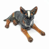Cattle Dog Laying, black/grey. Everyone loves a cattle dog, an Australian icon. There are 3 styles available.  As our Ceramic is hand blown and crafted, size, colour and markings may vary.  This figurine measures approx 5.3cm x 10cm x 9.5cm high.  Made in Thailand.