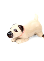 Floating beige and brown ceramic dog
