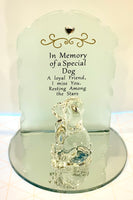 Beautiful memorial made from glass. Each piece is set on a mirrored circles with a lovely frosted glass backing with a a small heart  jewel and gold embossment. A glass cat or dog figurine sits in front of the memorial piece.  Saying:   Dog: In Memory of a Special Dog A loyal friend, I miss you, resting amount the stars.