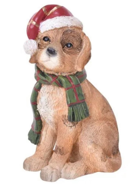Tan Resin dog in a scarf and Santa Hat