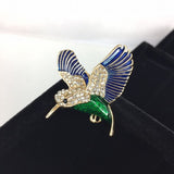 Beautiful bird in flight, green body with blue wings and crystal head