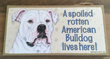 Sign with an image: A spoiled rotten American Bulldog lives here!