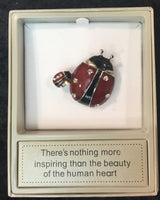 Ladybird brooch red and black with saying - There’s nothing more inspiring than the beauty of the human heart.