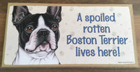 Sign with an image: A spoiled rotten Boston Terrier lives here!