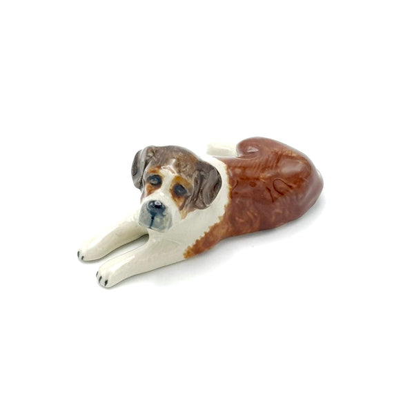 This brown and white St. Bernard is laying and could make a perfect companion for St Bernard of a different colour   This is a gray, white and black St Bernard that is lying down and would make a perfect partner to the one that is standing up.  As our ceramic animals are handcrafted and handpainted, size, colour and markings may vary.  Laying Down - This ceramic collectable figurine measures approx 8.5cm x 5cm x 3.5cm high.  Made in Thailand.