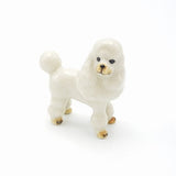 Standing White poodle figurine - A pretty white poodle with gray markings that is part of our extensive dog range.  As our ceramic animals are handcrafted and handpainted, size, colour and markings may vary.  This ceramic collectable figurine measures approx :  Sitting 6cm x 3.2cm x 6.1cm H  Made in Thailand.