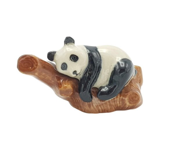 Ceramic Panda on a log
