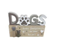 <p>Beautiful Sitting dog plaque with verse:</p> <p>DOGS leave footprints on your heart.</p> <p>Great gift for any dog lover or for those that have lost their beautiful dog. 15cm</p>