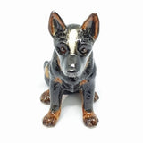 Cattle Dog Sitting, black/grey. Everyone loves a cattle dog, an Australian icon. There are 3 styles available.  As our Ceramic is hand blown and crafted, size, colour and markings may vary.  This figurine measures approx 5.3cm x 10cm x 9.5cm high.  Made in Thailand.