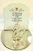 Beautiful memorial made from glass. Each piece is set on a mirrored circles with a lovely frosted glass backing with a a small heart  jewel and gold embossment. A glass cat or dog figurine sits in front of the memorial piece.  Saying:   Cat: In Memory of a Special Cat A loyal friend, I miss you, resting amount the stars.
