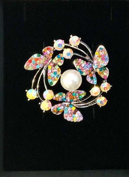 Beautiful Brooch with butterflies with multi coloured wings, on a circle wreath. Dimensions 4.5cm