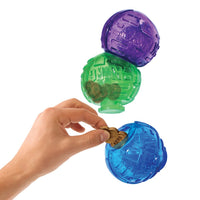 KONG Lock-it Medium, shown placing treats inside one of the 3 spheres, colours purple green and blue